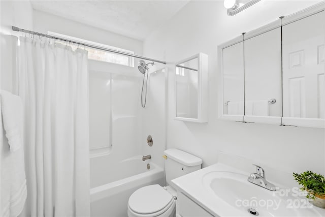 bathroom featuring toilet, vanity, and shower / bath combination with curtain