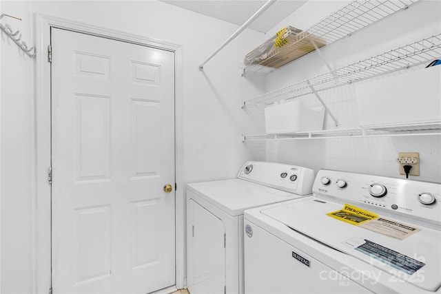 washroom featuring laundry area and independent washer and dryer