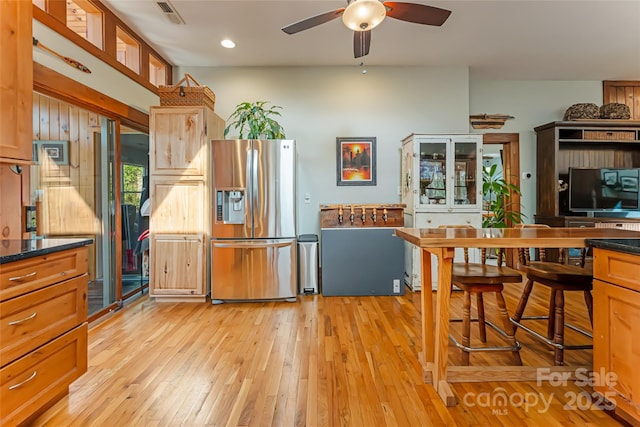 20 Meeks Rd, Black Mountain, NC 28711 - kitchen featuring stainless steel fridge with ice dispenser, visible vents, ceiling fan, light wood-type flooring, and dark countertops