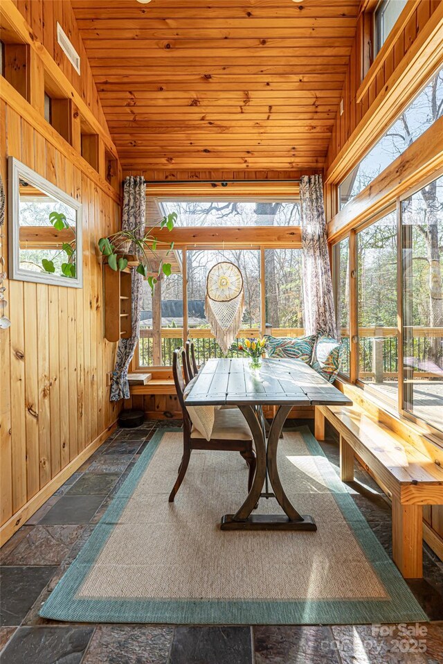 20 Meeks Rd, Black Mountain, NC 28711 - sunroom with baseboards, wooden walls, lofted ceiling, stone tile floors, and wooden ceiling