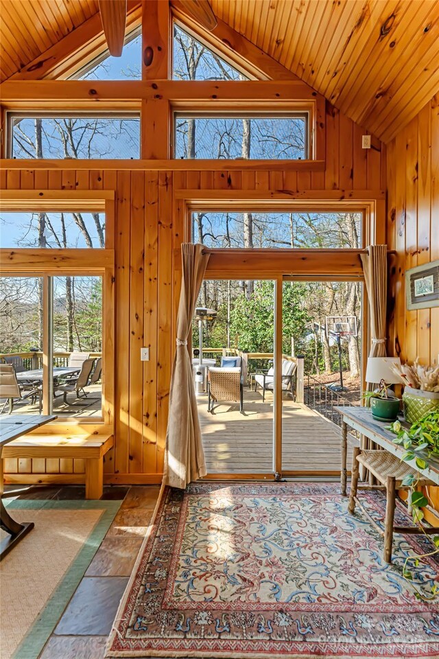 20 Meeks Rd, Black Mountain, NC 28711 - doorway with stone tile flooring, a wealth of natural light, high vaulted ceiling, and wood walls
