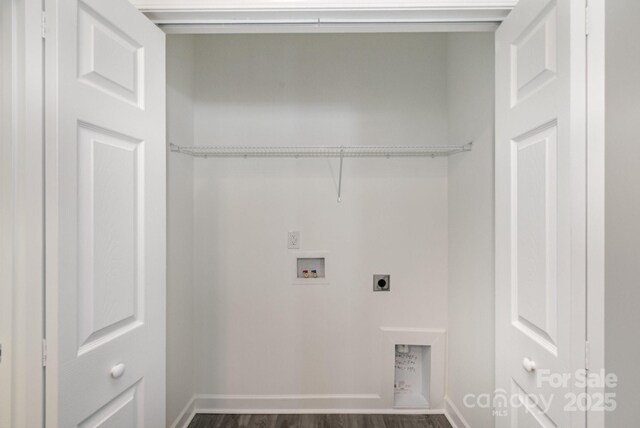 laundry area featuring baseboards, dark wood finished floors, washer hookup, laundry area, and hookup for an electric dryer