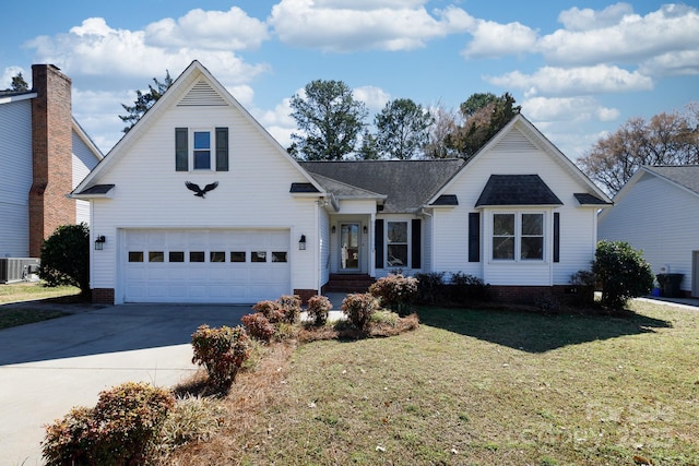 view of front of property with central AC, driveway, a front yard, and a garage