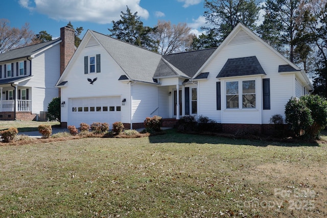 traditional home with a front lawn and a garage