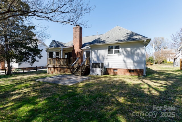 back of house featuring a patio, fence, a yard, a chimney, and crawl space