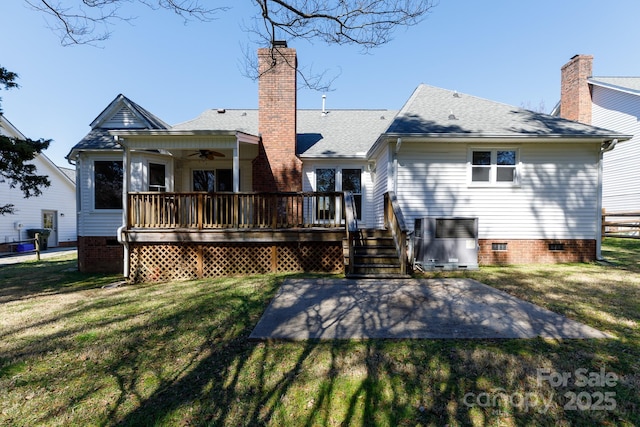 rear view of property with a ceiling fan, a wooden deck, a yard, a chimney, and crawl space