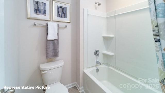 full bath with baseboards, toilet, and bathing tub / shower combination