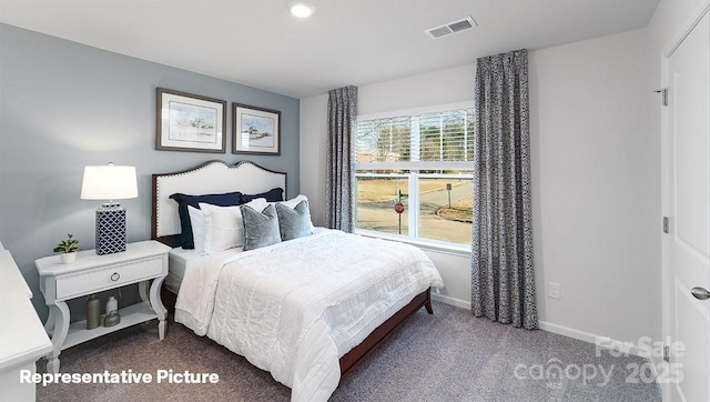 bedroom featuring carpet flooring, baseboards, and visible vents