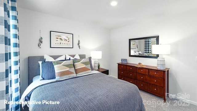 bedroom featuring baseboards and light colored carpet