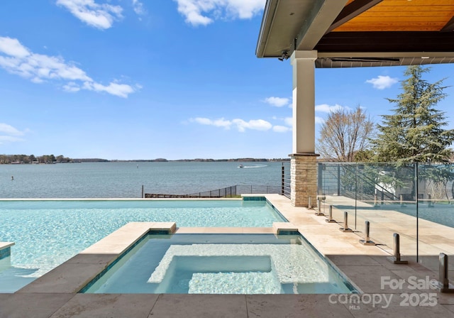 18601 Bluff Point Rd, Cornelius, NC 28031 - view of swimming pool with a pool with connected hot tub, fence, and a water view