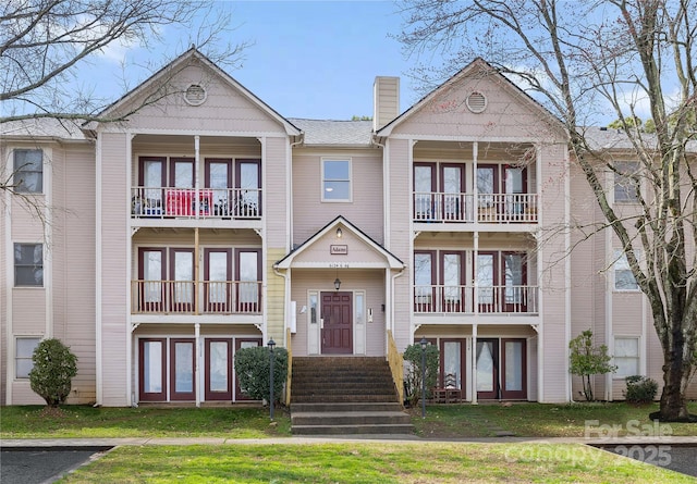 view of front of home with a chimney