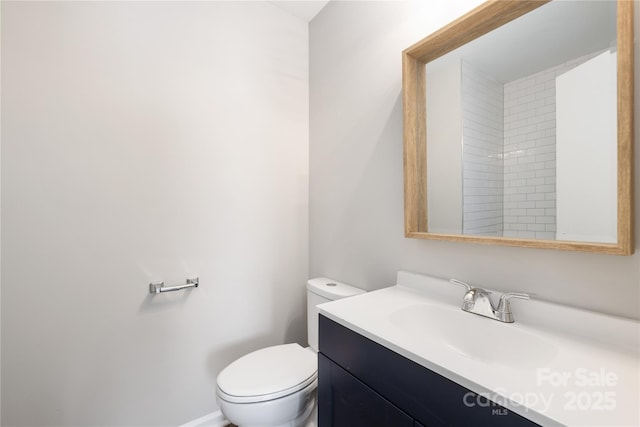 bathroom with toilet and vanity