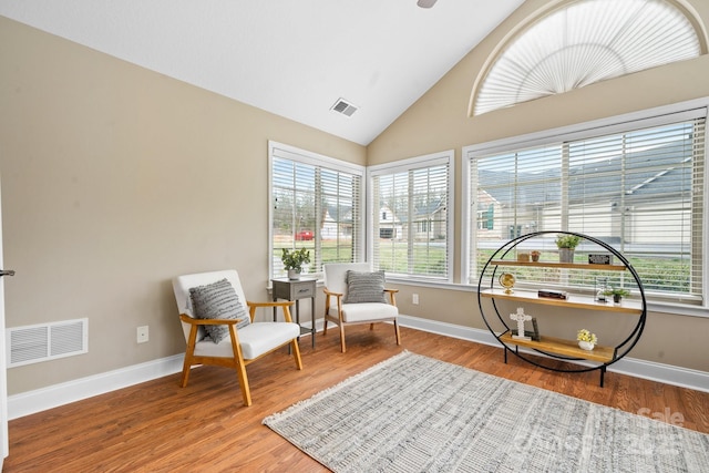 824 Wynnshire Dr Unit D, Hickory, NC 28601 - sitting room with wood finished floors, baseboards, and high vaulted ceiling