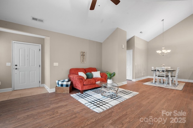 824 Wynnshire Dr Unit D, Hickory, NC 28601 - living area featuring a ceiling fan, light wood-style floors, a chandelier, baseboards, and high vaulted ceiling