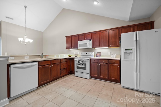 824 Wynnshire Dr Unit D, Hickory, NC 28601 - kitchen featuring white appliances, high vaulted ceiling, a chandelier, light tile patterned floors, and light countertops