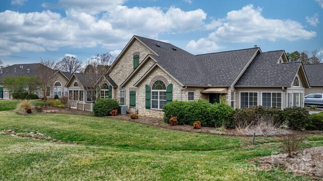 824 Wynnshire Dr Unit D, Hickory, NC 28601 - view of front facade with stone siding, a front yard, and a shingled roof