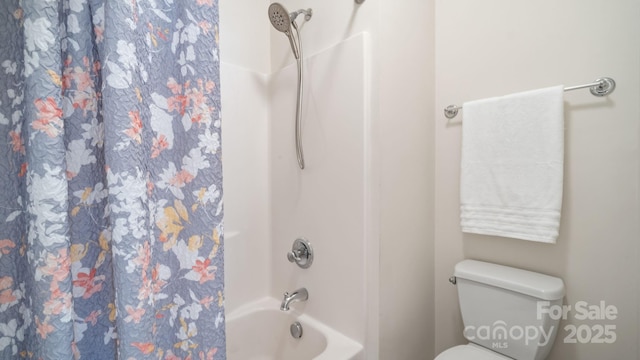 bathroom with toilet and shower / bathtub combination with curtain