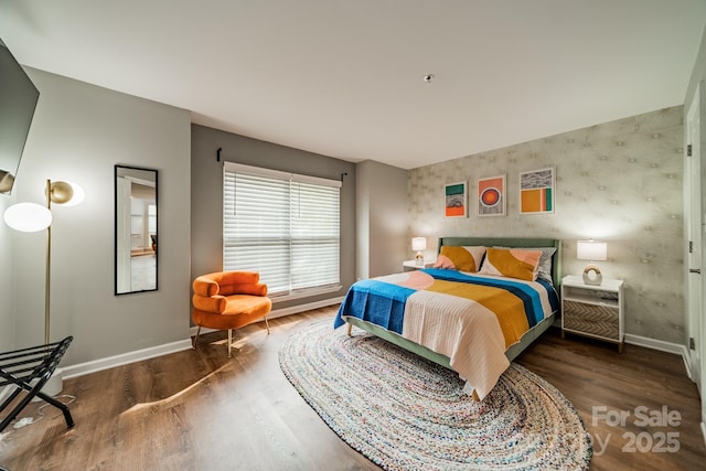 513 N Graham St Unit 3H, Charlotte, NC 28202 - bedroom with baseboards and wood finished floors