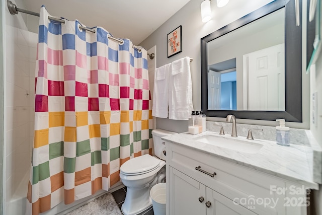 513 N Graham St Unit 3H, Charlotte, NC 28202 - bathroom featuring a shower with shower curtain, vanity, and toilet