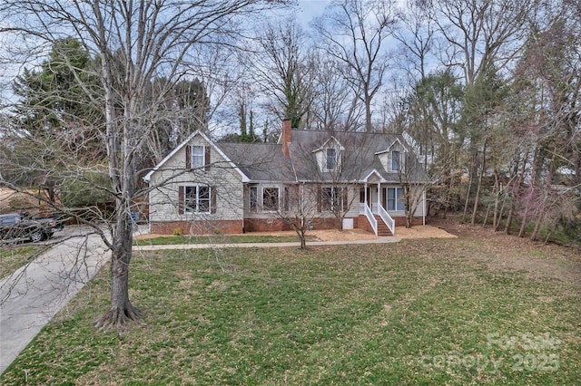 view of front of house with a front lawn and a chimney