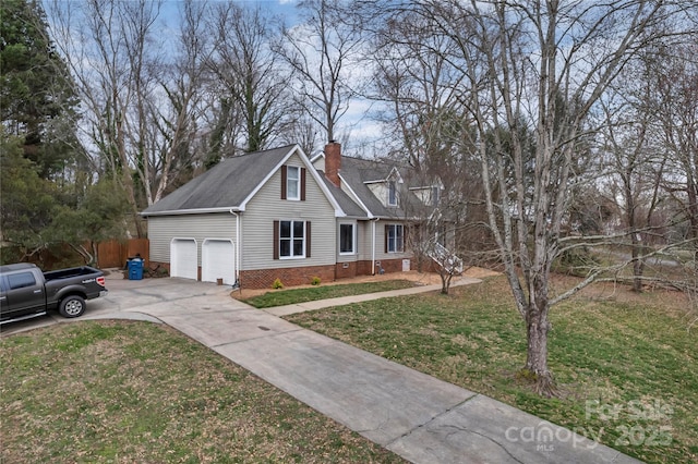 view of front of home with a front yard, fence, driveway, and a chimney