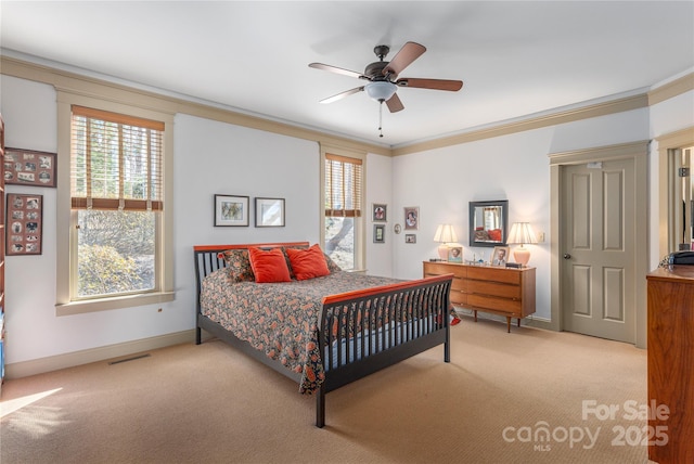 bedroom with baseboards, carpet floors, visible vents, and ornamental molding