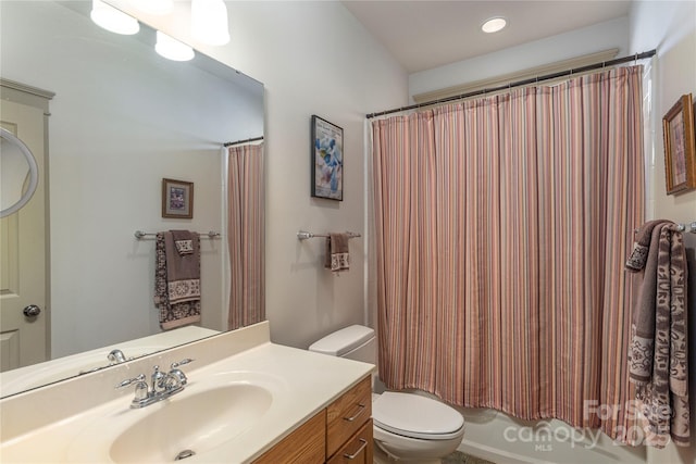 full bathroom with recessed lighting, toilet, and vanity