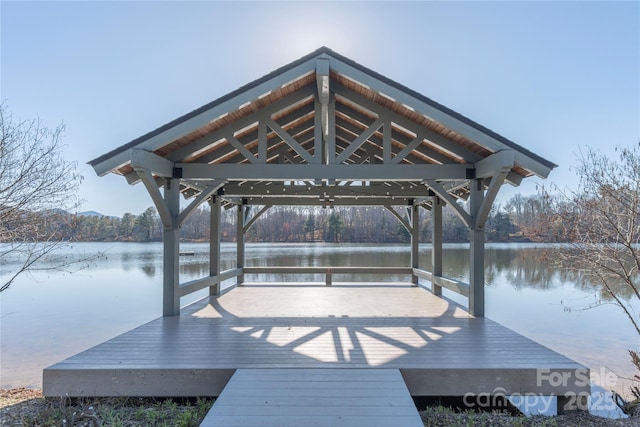 dock area with a gazebo and a water view