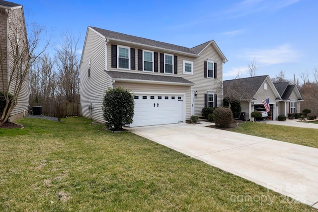 traditional home with driveway, a front yard, and a garage