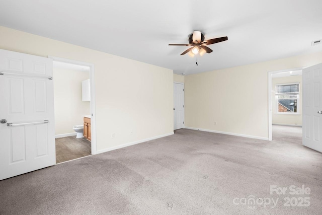 unfurnished bedroom with light carpet, visible vents, and baseboards