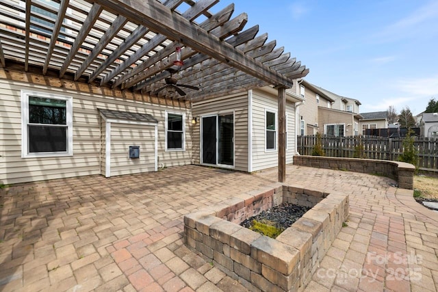 view of patio featuring ceiling fan, a pergola, and fence