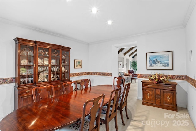 dining area with recessed lighting, a wainscoted wall, light carpet, and ornamental molding