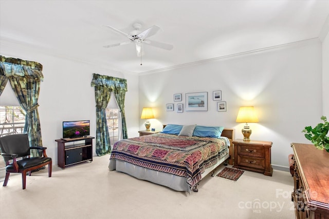 bedroom with carpet flooring, ceiling fan, and crown molding