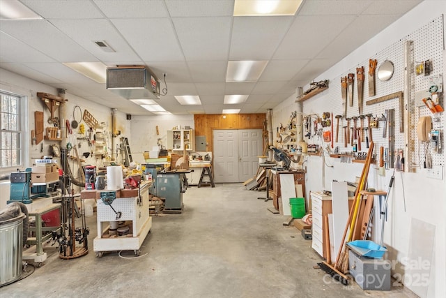 garage with a workshop area and visible vents