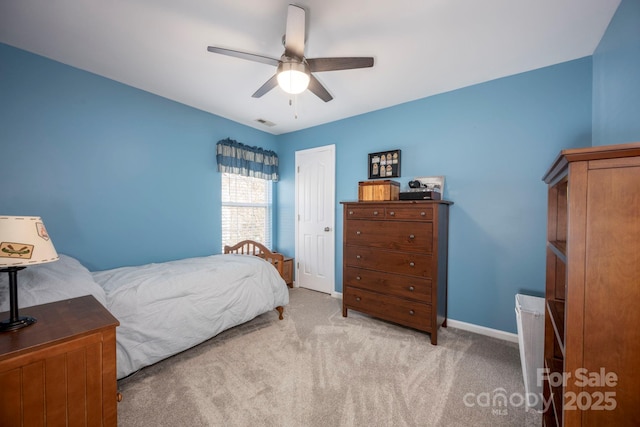 bedroom with baseboards, visible vents, carpet floors, ceiling fan, and a closet