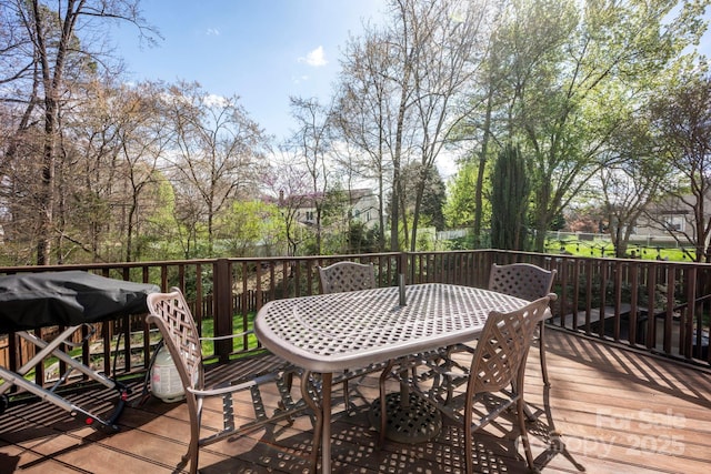 deck with outdoor dining area