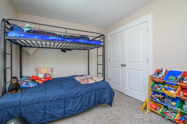 carpeted bedroom with a closet