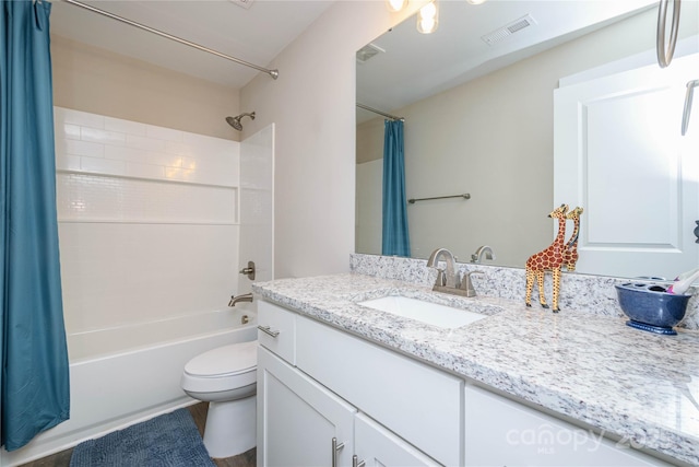 full bathroom featuring visible vents, toilet, vanity, and shower / bathtub combination with curtain