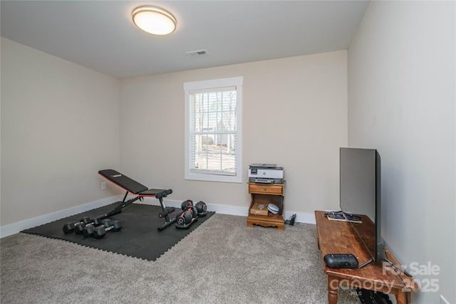 workout area with visible vents, carpet floors, and baseboards