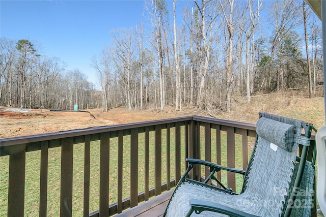 wooden terrace with a yard