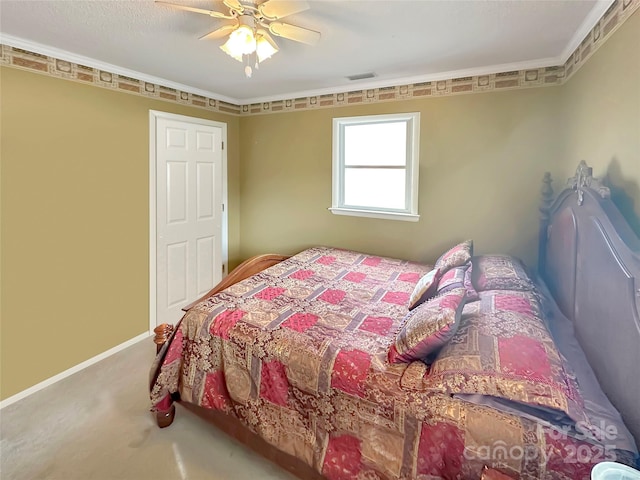 bedroom featuring baseboards, carpet floors, ceiling fan, and crown molding