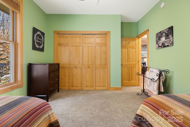 carpeted bedroom featuring a closet