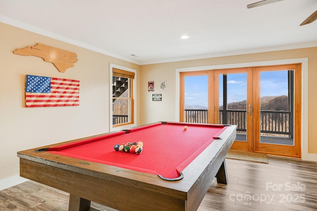 game room featuring recessed lighting, crown molding, baseboards, and wood finished floors