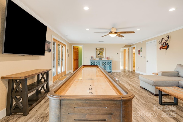 recreation room with recessed lighting, light wood-style floors, and baseboards