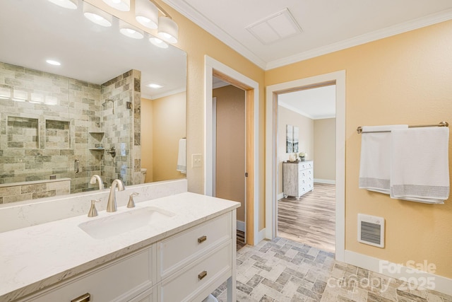 bathroom with visible vents, baseboards, walk in shower, and crown molding