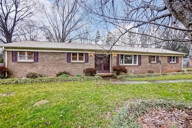 ranch-style house with brick siding and a front lawn