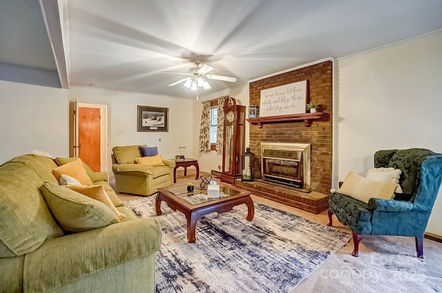 living area featuring a ceiling fan and a fireplace