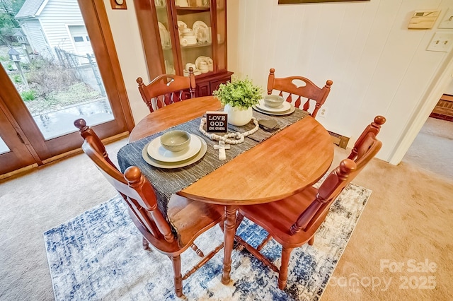 dining area with carpet flooring