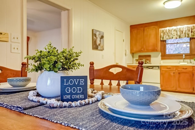 interior space with brown cabinetry and a sink