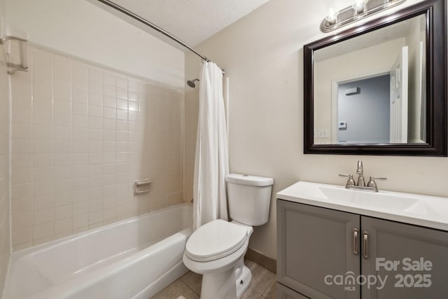 bathroom with toilet, vanity, shower / bath combo, tile patterned floors, and a textured ceiling